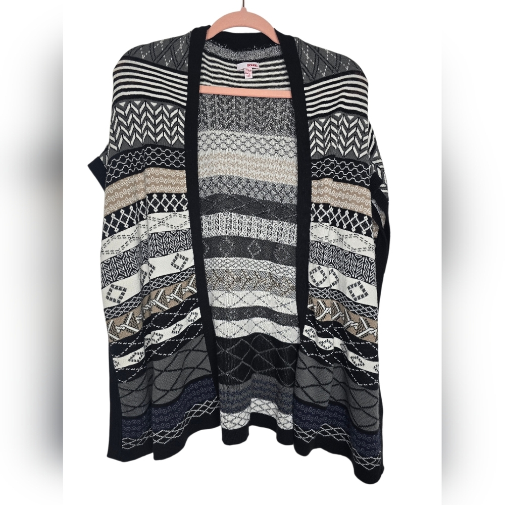 Bongo Aztec pattern cardigan sweater wrap, often styled as a poncho. 